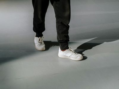 Sneakers on a dark floor in a studio